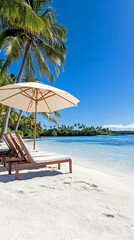Idyllic tropical beach with lounge chairs under umbrella, palm trees and turquoise sea, perfect for vacation, travel