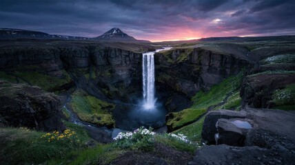 Majestic Waterfall at Sunset in Iceland's Dramatic Landscape