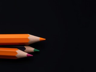 Orange green magenta pencils sharp points drawing