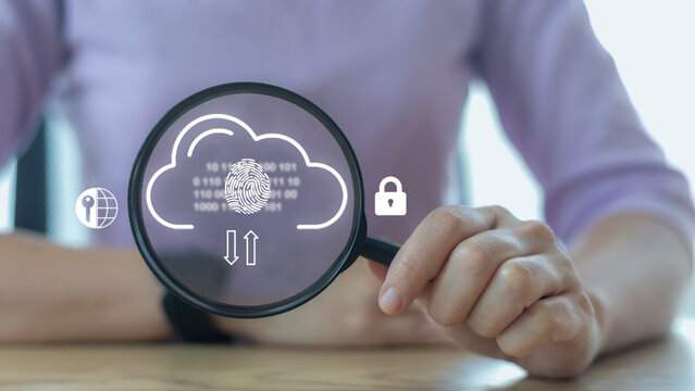 Businesswoman holding magnifying glass focusing on cloud security, fingerprint authentication, and data encryption icons for secure cloud computing and cyber