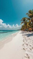The pristine white sandy beach stretches into the distance.