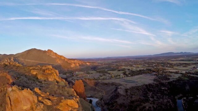 Golden light illuminates the cliffs at smith rock state park