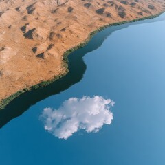 Winding reflective river across open valley, shadows and cloud coverage