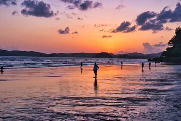 Fototapeta premium Thailand - Krabi - Ao Nang Beach sunset July 27th 2025. This was on a beautiful evening during the wet season. The Andaman sea during the low season surrounded by beautiful mountains. 