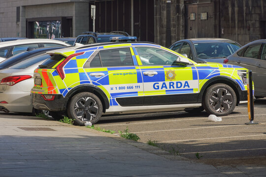 Dublin, Ireland A Garda vehicle is parked on a Dublin street, showcasing its distinctive markings and colors in a busy urban environment.