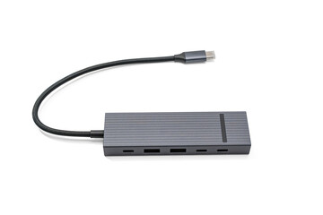 USB-C Hub Flat View. A sleek, dark gray USB-C hub with multiple ports, isolated on a white...