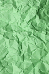Crumpled green paper background texture