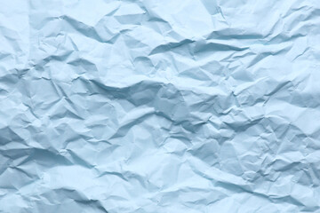 Fototapeta premium Crumpled blue paper background. Natural texture