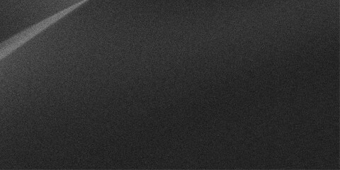 Abstract diagonal light beam on textured dark gray background with subtle grain effect