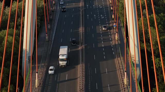 Aerial view of a bridge over the Vistula river, on which many cars move. Warsaw, Poland. Siekierki (Siekierkowski) Bridge