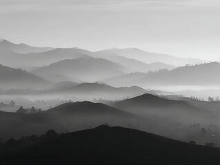 Obraz premium Misty mountains in black and white with layered peaks