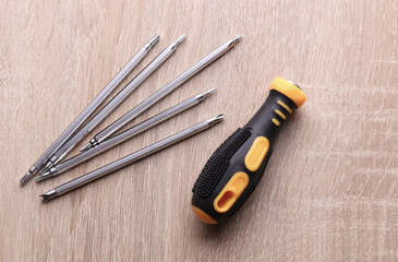 Screwdriver with bits on the table