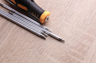 Screwdriver with bits on the table