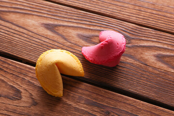 Two fortune cookies on wooden background