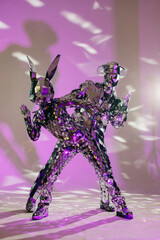 Mirror dancers performing in purple light: rabbit and cowboy dancing together