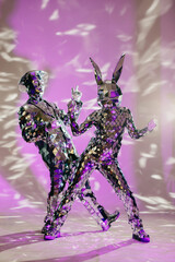 Mirror dancers performing on stage with purple lighting