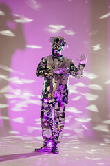 Mirror man dancing with suit and hat in purple lights