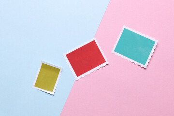 Blank Postal paper adhesive stamps on pink blue background. Marks for letter