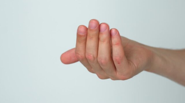 A man's hand on a white background calls someone and asks them to come.
Gesture follow me.
A beckoning and inviting man.
Hand, call, invite, follow