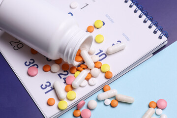 Paper calendar planner with pills. Medicine and health care, treatment concept