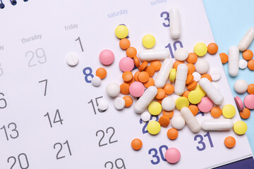 Paper calendar planner with pills. Medicine and health care, treatment concept
