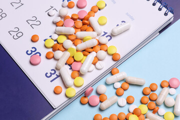 Paper calendar planner with pills. Medicine and health care, treatment concept