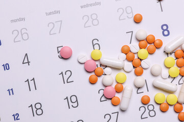 Paper calendar planner with pills. Medicine and health care, treatment concept