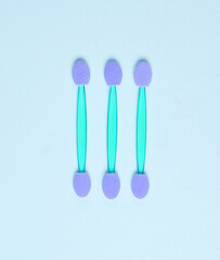 Set of applicators for makeup on a blue background