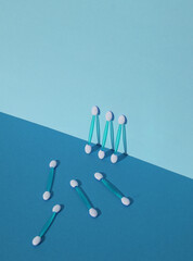 Set of applicators for makeup on blue background with shadow. Creative layout