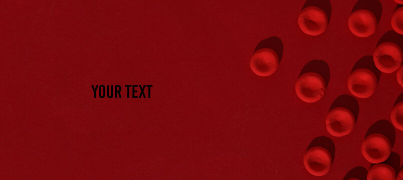Red blood cells model on red background. Copy space for your text