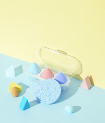 Makeup sponges blenders on pastel background with shadow. Beauty concept. Creative layout,...