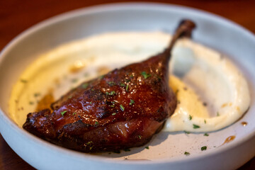 Tender duck confit with crispy skin, served with mashed potato