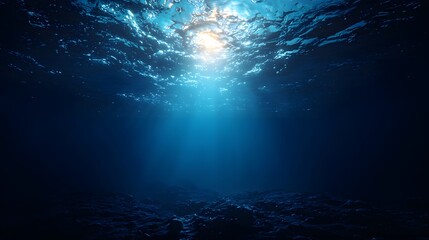 Obraz premium Deep ocean depths illuminated by sunlight.