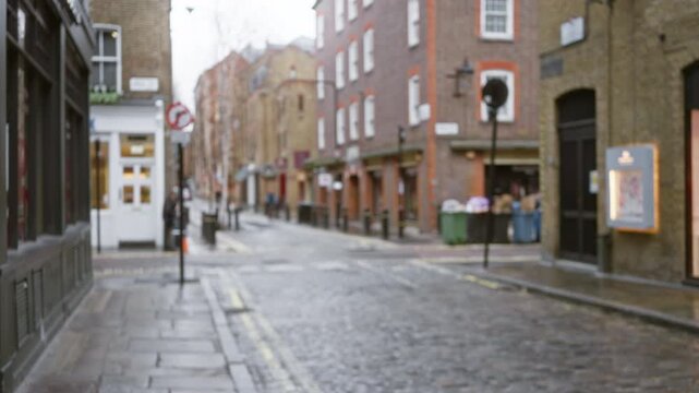 Blurry london street scene in seven dials with diffused winter atmosphere and brick buildings, capturing the essence of an overcast day in this iconic uk location.
