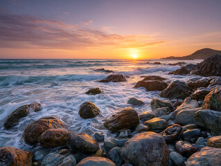 Ocean waves crash on rocky shore at sunset with colorful sky