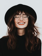 Brunette Woman Laughing in Black Hat and Glasses