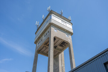Rudolfka lookout tower stands tall against the clear blue sky, once a mining tower, now an...