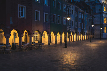 Evening glow of Poznan Market Square highlighting historic architecture and town hall