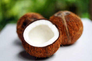 Natural Brown Coconut Fruit on White Surface.