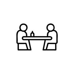Two people sitting at a table with a bottle between them communication