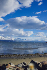 Mountain view with beautiful clouds in the sky and a lake 