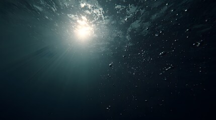 Sunlight piercing the dark depths of the ocean.
