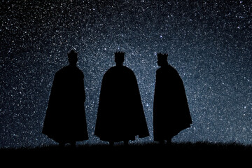 minimalist depiction of three wise men standing together beneath starry night sky