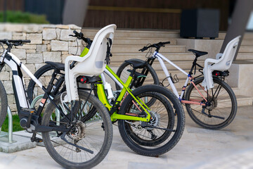 Bicycles for Rent with Baby Seats. Sustainable Travel and Leisure Activity