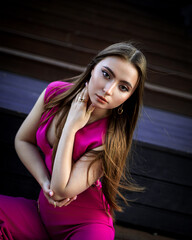 Portrait of beautiful young girl at city center among office buildings