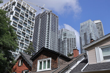 high rise apartment buildings near traditional residential neighborhood of single family homes