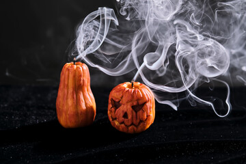 Halloween-style candles on a dark background. Festive decor.
