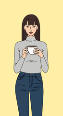 Woman with Brown Hair Holding Steaming Coffee Cup in Casual Outfit.