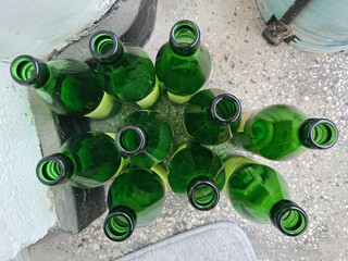 empty green beer bottle on the floor