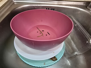 washing dishes in the kitchen. dirty dishes in the sink in the kitchen